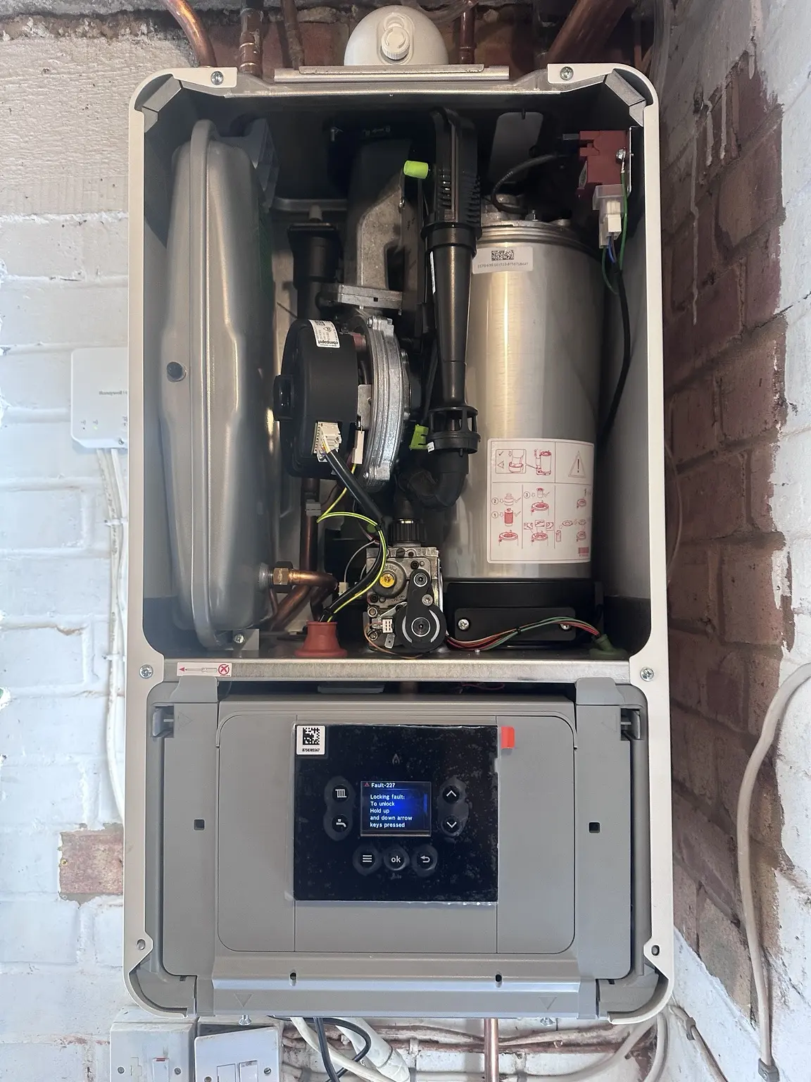 Plumber repairing domestic pipework in a Reading property